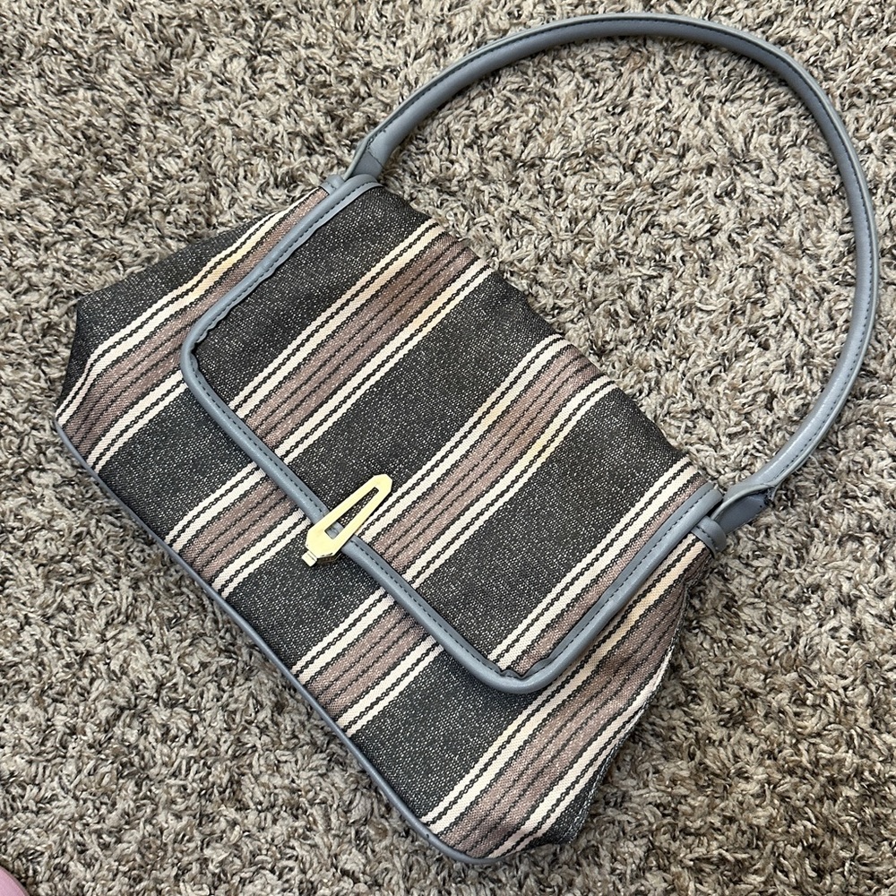 used fabric flap handbag